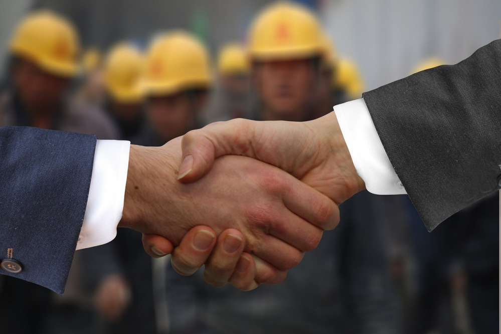 Workers agreement handshake